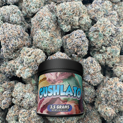 Jar of Gushlato candy surrounded by flower