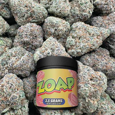 Jar of 'ZOAP' product on a bed of flower
