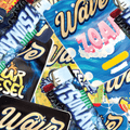 Collection of colorful  Tsunami 'Wave' brand product packaging with various designs.