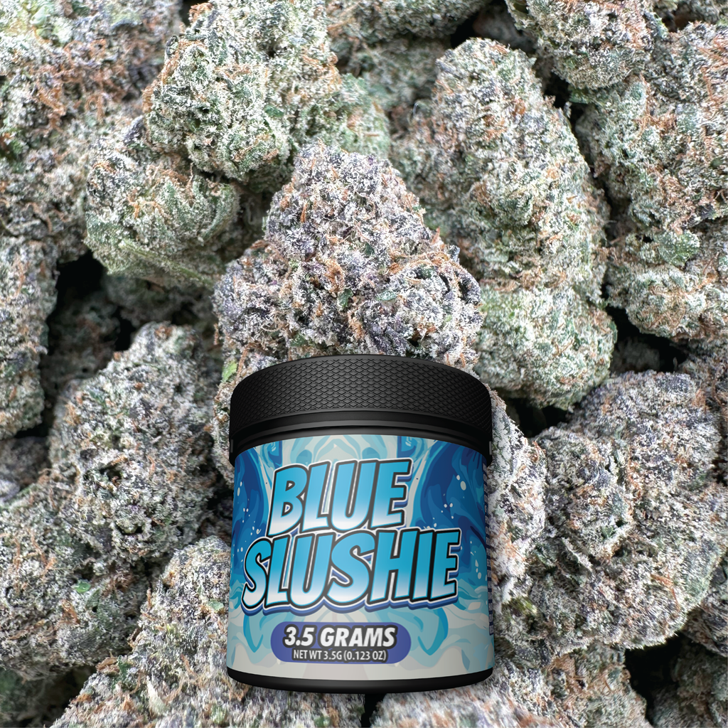 Container labeled 'Blue Slushie' surrounded by cannabis buds