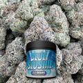 Container labeled 'Blue Slushie' surrounded by cannabis buds