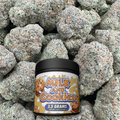 Jar labeled 'Milk and Cookies' on a background of buds