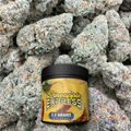 Jar of 'Pineapple Express' on a background of buds