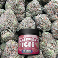 Jar of Raspberry Icee candy with buds in the background