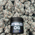 Black jar labeled 'Skywalker OG' on a bed of buds